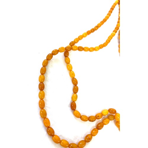 556 - Vintage long amber bead necklace, approximate weight of necklace 89g, approximate length 250cm