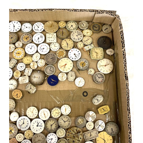 568 - Box of wristwatch movements, spares and repairs