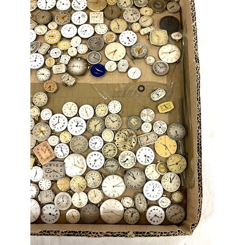 568 - Box of wristwatch movements, spares and repairs