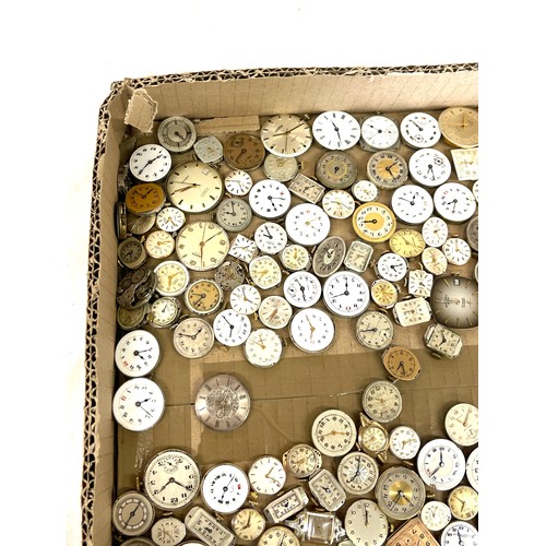 568 - Box of wristwatch movements, spares and repairs