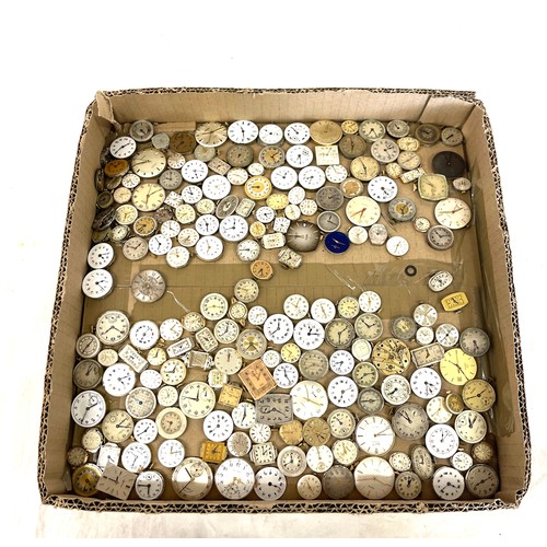 568 - Box of wristwatch movements, spares and repairs