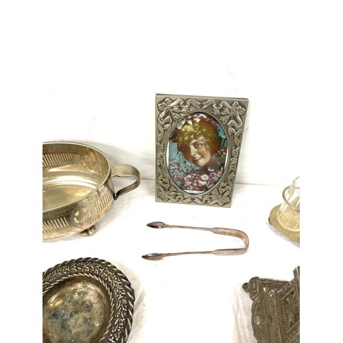 79 - Selection of silver plated items includes photo frames etc