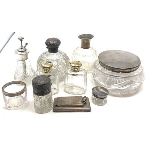 57 - Selection of silver items includes scent bottles silver top jars etc