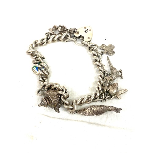 541 - Selection silver jewellery to include charm bracelet, guard chain, chains etc total approximate weig... 