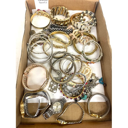 557 - Selection of ladies costume bangles and various ladies watches, all untested