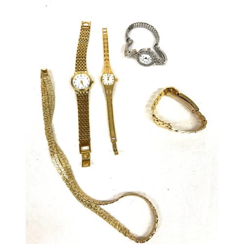 566 - Selection of ladies watches, gold tone necklace, watch strap etc