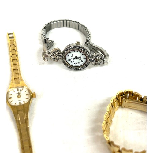 566 - Selection of ladies watches, gold tone necklace, watch strap etc