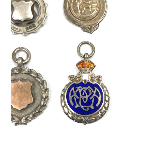 566 - Selection of 4 silver fobs includes one silver enamel