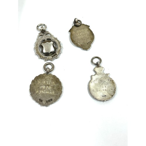 566 - Selection of 4 silver fobs includes one silver enamel