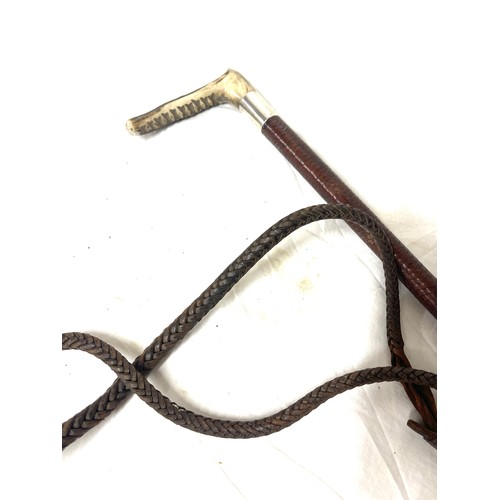 79 - Silver mounted leather riding crop - London 1938 and a crocodile skin wallet