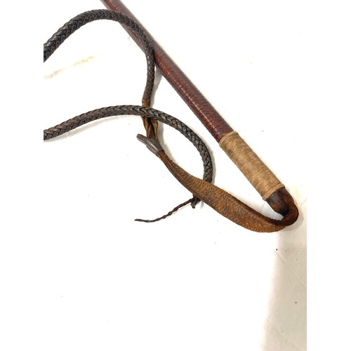 79 - Silver mounted leather riding crop - London 1938 and a crocodile skin wallet