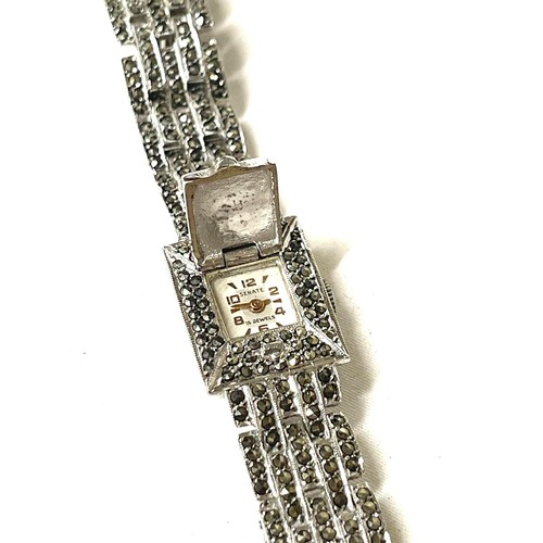 550 - Silver ladies vintage cocktail watch, winds and ticks but no warranty given