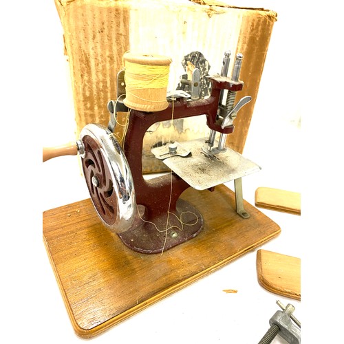 128 - The Essex miniature sewing machine, with original damaged box