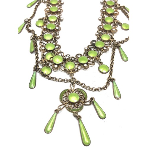 193 - An antique Scandinavian silver gilt necklace , with  lower filigree links and pale green enamel deco... 