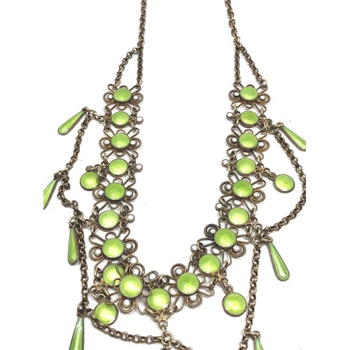 193 - An antique Scandinavian silver gilt necklace , with  lower filigree links and pale green enamel deco... 