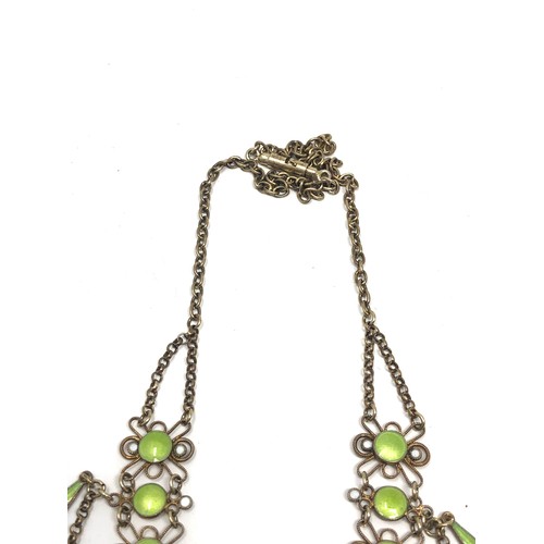 193 - An antique Scandinavian silver gilt necklace , with  lower filigree links and pale green enamel deco... 