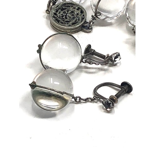 90 - An antique polished rock crystal orb pool of light necklace, silver fittings  With a matching pair o... 