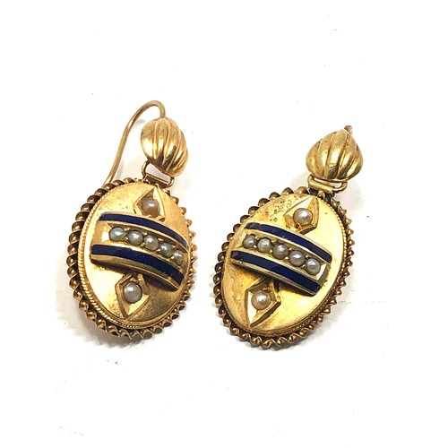 99 - A pair of antique English, 15 carat gold earrings; with applied designs decorated with blue enamel &... 