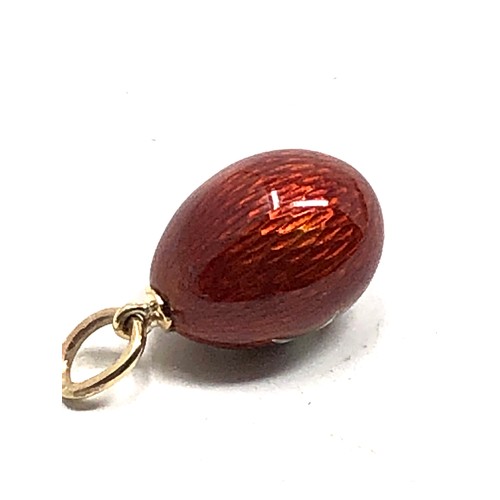 157 - rare antique 14 carat gold  Easter egg charm; finely made, with red enamel around a white enamel Mal... 