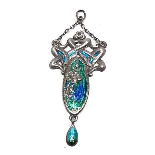 110 - An antique silver pendant, with  Art Nouveau floral designs decorated with blue &  green enamelling.... 