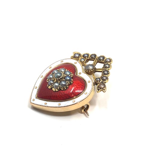 168 - A fine antique 15 ct  gold brooch with red guilloche enamel, white enamel bordered heart-shaped body... 