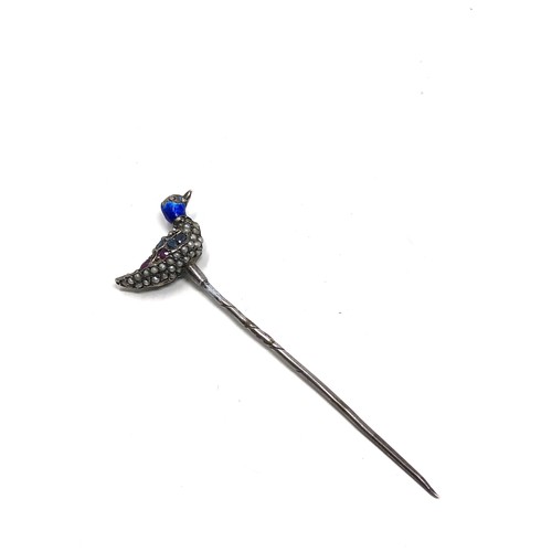 150 - An antique silver stickpin, topped with a duck decorated with blue enamel and pave set with seed pea... 