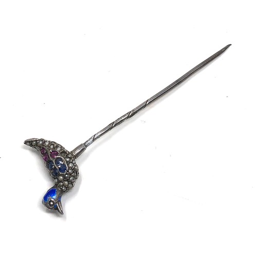 150 - An antique silver stickpin, topped with a duck decorated with blue enamel and pave set with seed pea... 