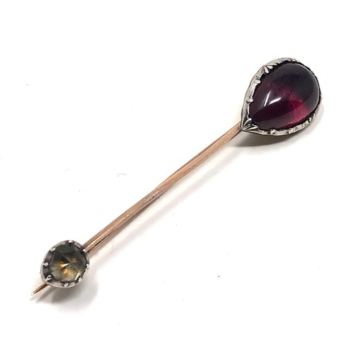 152 - An antique gold halley,s comet style foiled pear shaped cabochon almandine garnet and a foiled facet... 