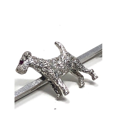 120 - An antique 15 ct white gold & 18ct white gold & diamond fox terrier bar brooch;   set throughout wit... 