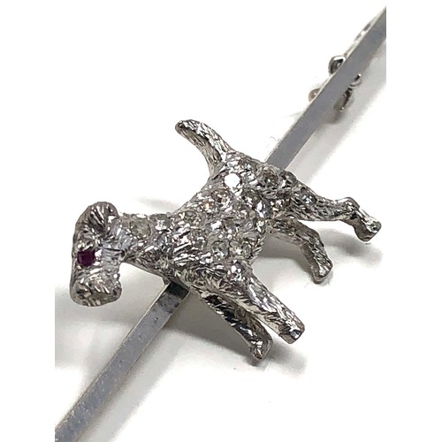 120 - An antique 15 ct white gold & 18ct white gold & diamond fox terrier bar brooch;   set throughout wit... 