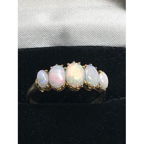 175 - An antique 18ct gold opal ring