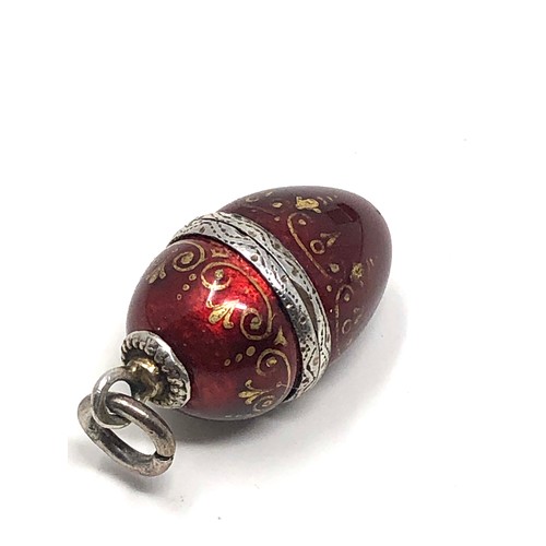 143 - An antique Austro Hungarian silver egg shaped vinaigrette with red &  gold enamel decoration to the ... 