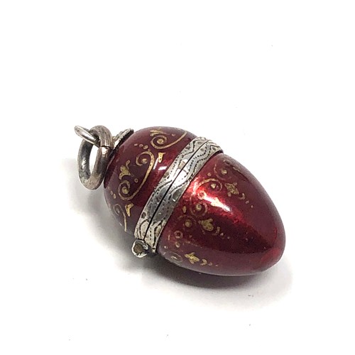 143 - An antique Austro Hungarian silver egg shaped vinaigrette with red &  gold enamel decoration to the ... 