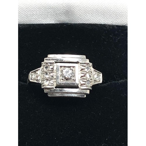 135 - An Art Deco 18 carat white gold diamond ring