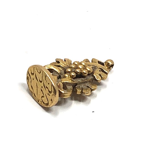 186 - Heavy antique high carat gold islamic fob, with entwined grape vine body and inscribed to the base w... 