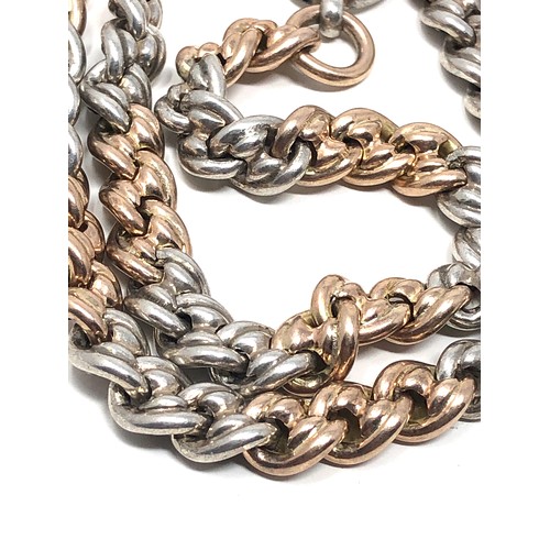 141 - An unusual antique Albert watch chain, with alternating strands of 9 carat gold &  sterling silver l... 