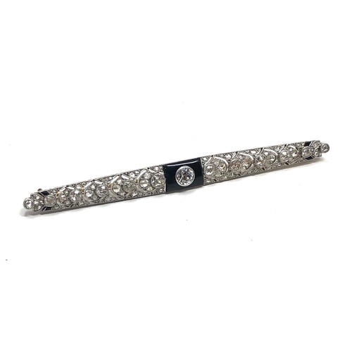 176 - Fine antique platinum onyx & diamond brooch; , set with chunky old cut diamonds surrounded by tiny r... 