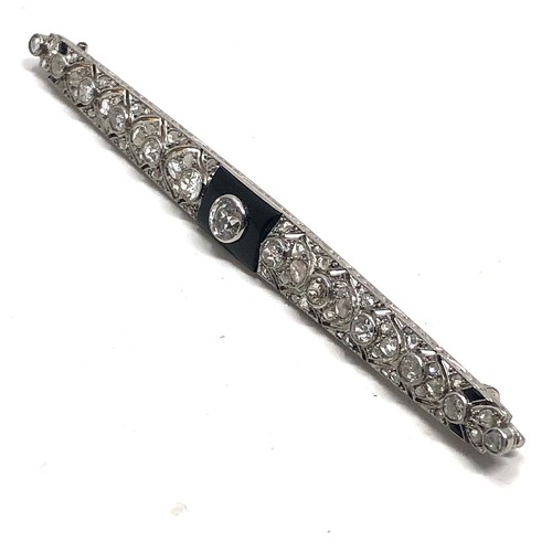 176 - Fine antique platinum onyx & diamond brooch; , set with chunky old cut diamonds surrounded by tiny r... 