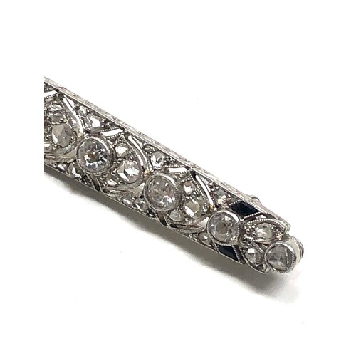 176 - Fine antique platinum onyx & diamond brooch; , set with chunky old cut diamonds surrounded by tiny r... 