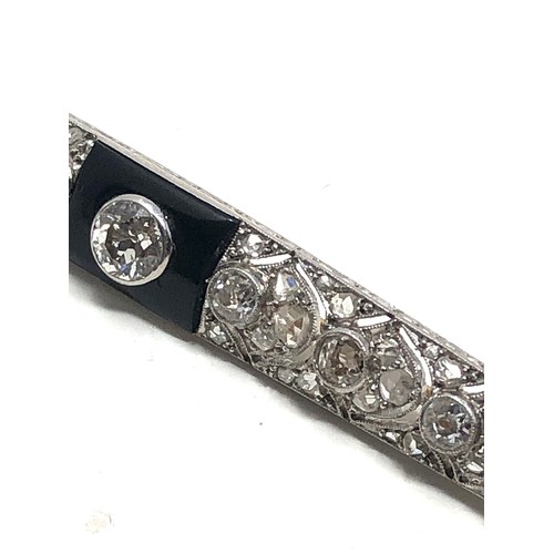 176 - Fine antique platinum onyx & diamond brooch; , set with chunky old cut diamonds surrounded by tiny r... 