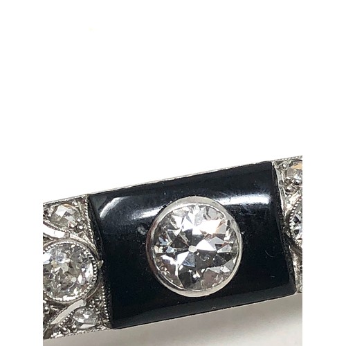 176 - Fine antique platinum onyx & diamond brooch; , set with chunky old cut diamonds surrounded by tiny r... 