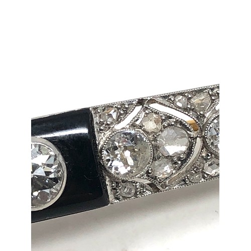 176 - Fine antique platinum onyx & diamond brooch; , set with chunky old cut diamonds surrounded by tiny r... 