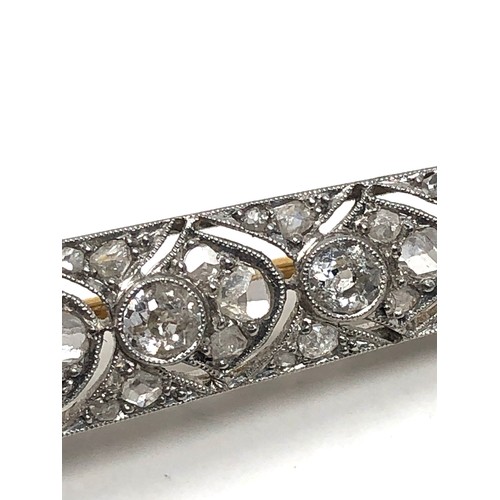 176 - Fine antique platinum onyx & diamond brooch; , set with chunky old cut diamonds surrounded by tiny r... 