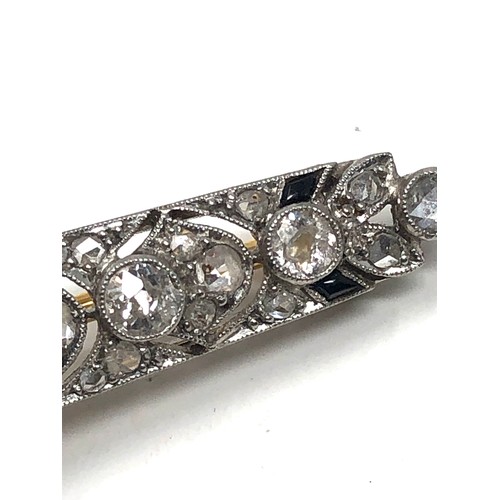 176 - Fine antique platinum onyx & diamond brooch; , set with chunky old cut diamonds surrounded by tiny r... 