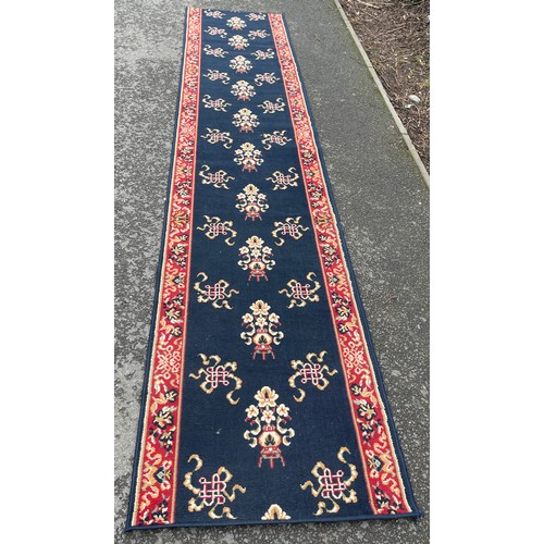 572 - Large hallway rug / runner, approximate length 155cm by 33cm