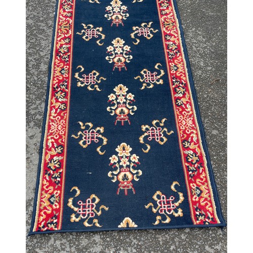 572 - Large hallway rug / runner, approximate length 155cm by 33cm