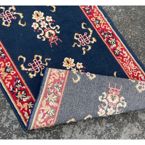 572 - Large hallway rug / runner, approximate length 155cm by 33cm