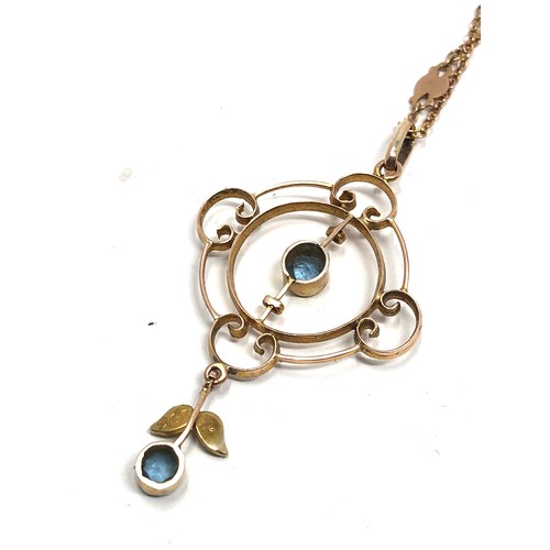 189 - An antique Edwardian 9 carat gold pendant set with  pearls and aquamarines, hung on a 9k gold fancy ... 