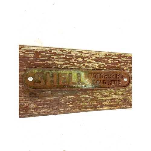 65 - Shell cast iron plaque, Motor spirit sold here, wooden plaque measurements: 52cm by 16, actual Shell... 