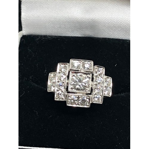 156 - An Art Deco style platinum diamond ring; white diamonds in geometric millegrain settings. Stamped 'P... 